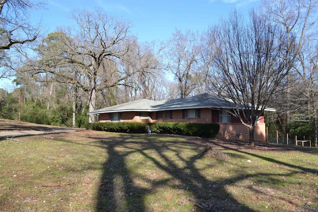 view of home's exterior featuring a yard