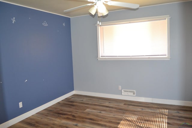 unfurnished room featuring ceiling fan and dark hardwood / wood-style floors