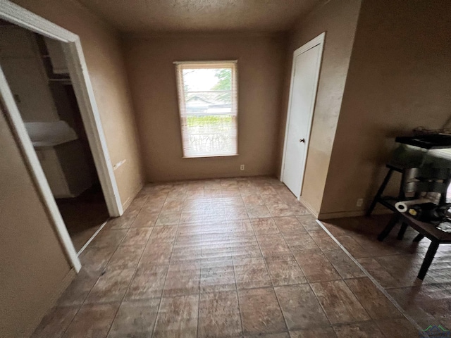 242 E Main St, Van, TX 75790 - unfurnished bedroom featuring a textured ceiling
