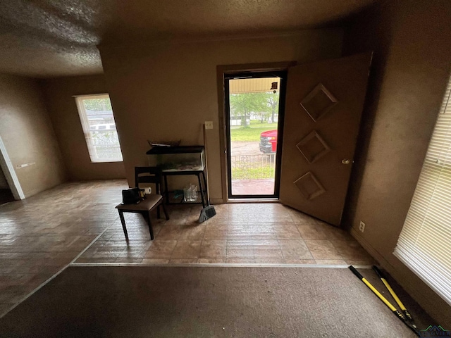 242 E Main St, Van, TX 75790 - foyer entrance featuring a textured ceiling