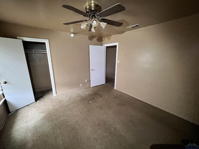 unfurnished bedroom featuring ceiling fan, concrete flooring, and a closet