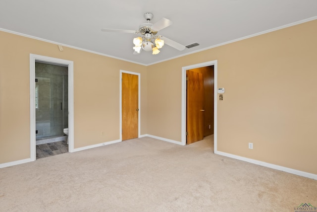 unfurnished bedroom featuring baseboards, ornamental molding, and light carpet