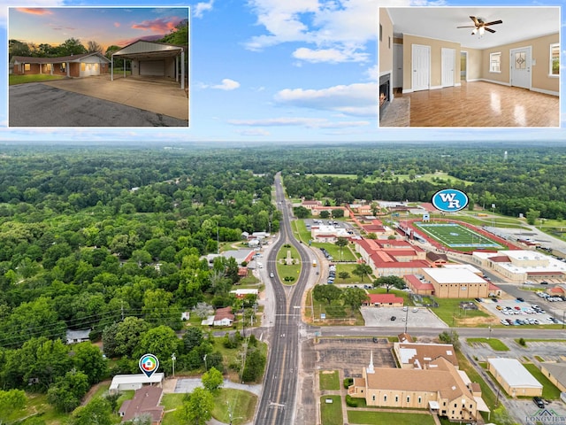birds eye view of property featuring a forest view