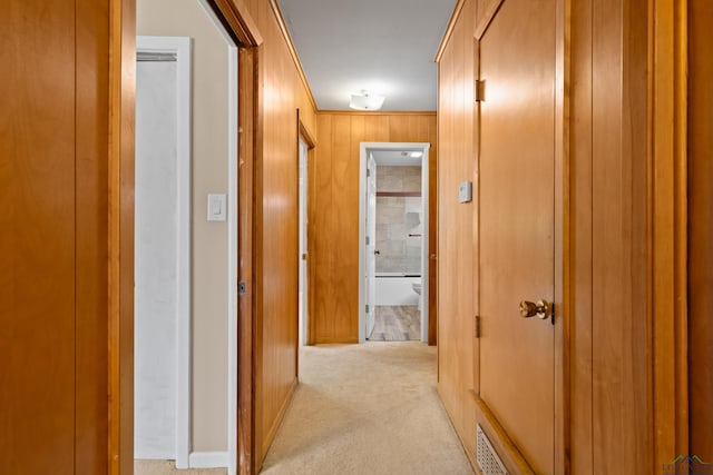10870 S Main St, Overton, TX 75684 - hall with wooden walls and light carpet
