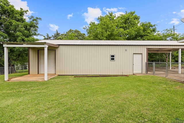 view of outbuilding featuring fence and an outdoor structure