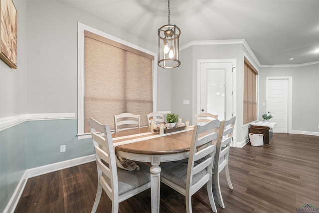 dining room featuring baseboards, ornamental molding, and dark wood-type flooring