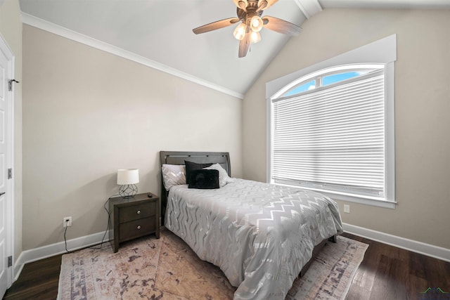 bedroom featuring baseboards, wood finished floors, and lofted ceiling