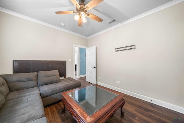 living room featuring visible vents, dark wood-type flooring, and crown molding