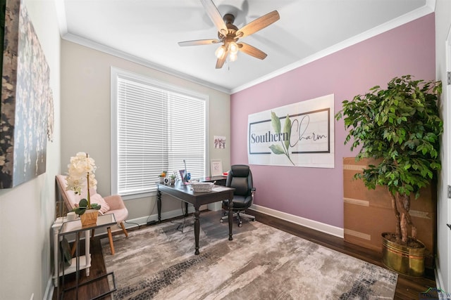 office area with baseboards, dark wood-type flooring, ceiling fan, and ornamental molding