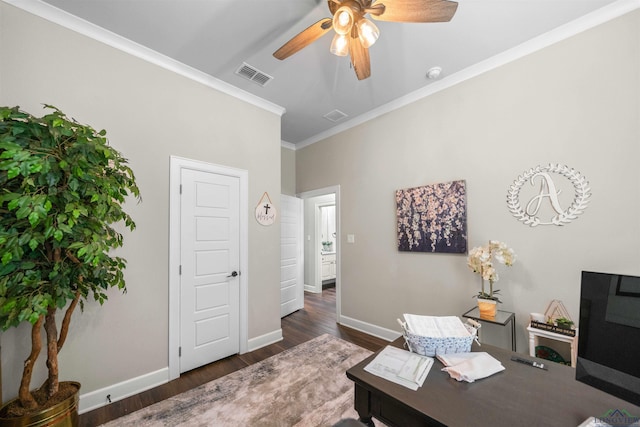 home office with crown molding, a ceiling fan, baseboards, visible vents, and dark wood finished floors