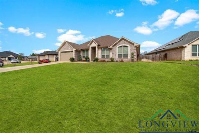 view of front of home with a front lawn, driveway, and an attached garage