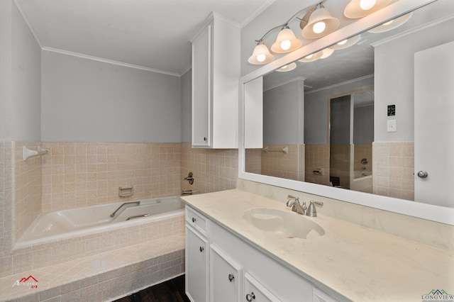 bathroom featuring vanity, a relaxing tiled tub, and crown molding