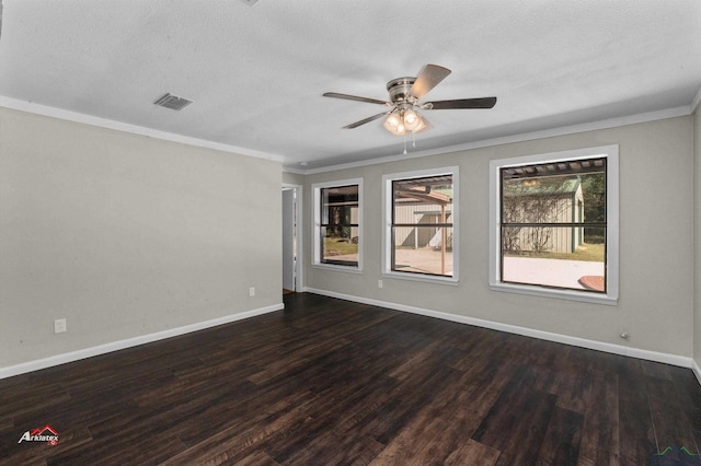 spare room featuring ornamental molding, a textured ceiling, ceiling fan, and dark wood-type flooring