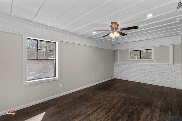 spare room with dark hardwood / wood-style floors and ceiling fan