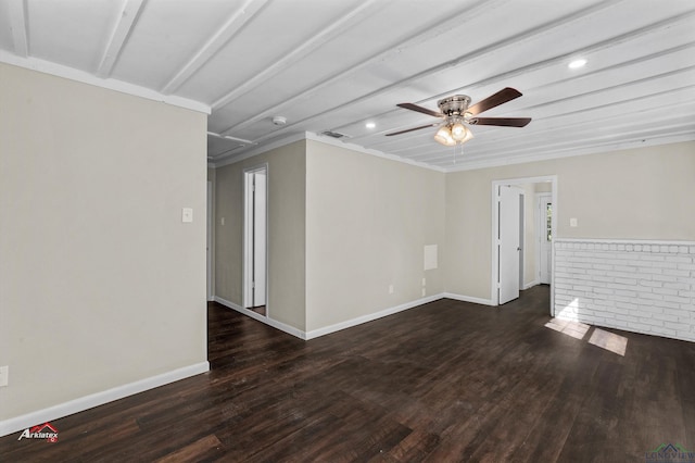 spare room featuring dark hardwood / wood-style flooring and ceiling fan