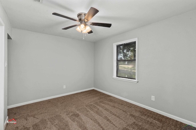 carpeted empty room featuring ceiling fan