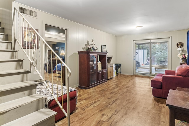 living room with light hardwood / wood-style floors