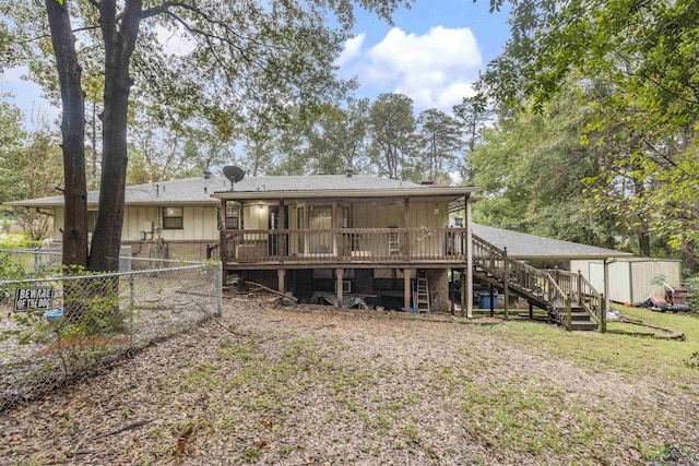 rear view of house featuring a deck