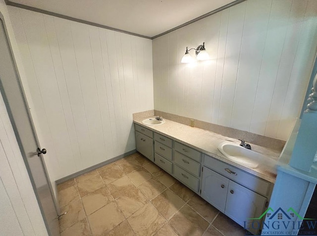 bathroom featuring vanity, wood walls, and ornamental molding