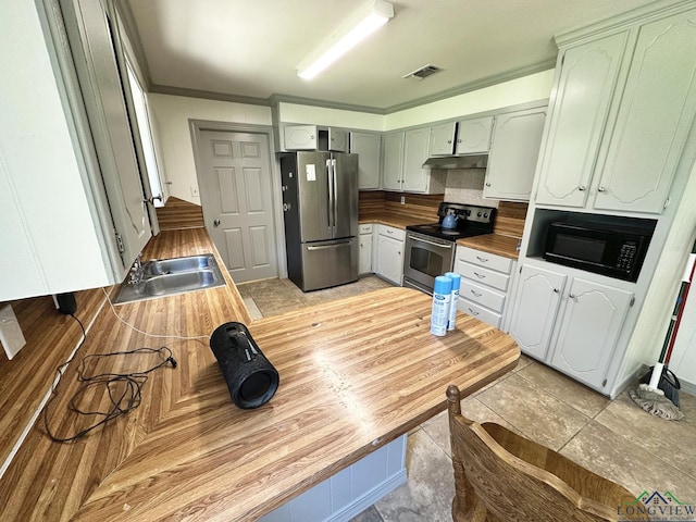 kitchen featuring decorative backsplash, stainless steel appliances, crown molding, and sink