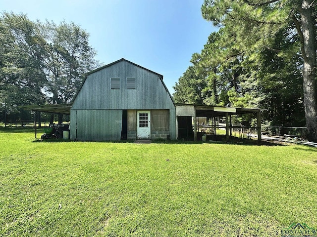 view of outbuilding with a yard