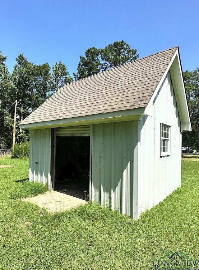 view of outdoor structure with a lawn