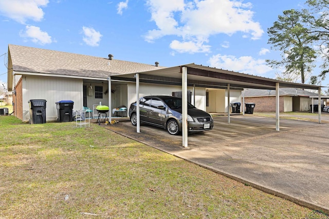 view of parking featuring an attached carport and driveway