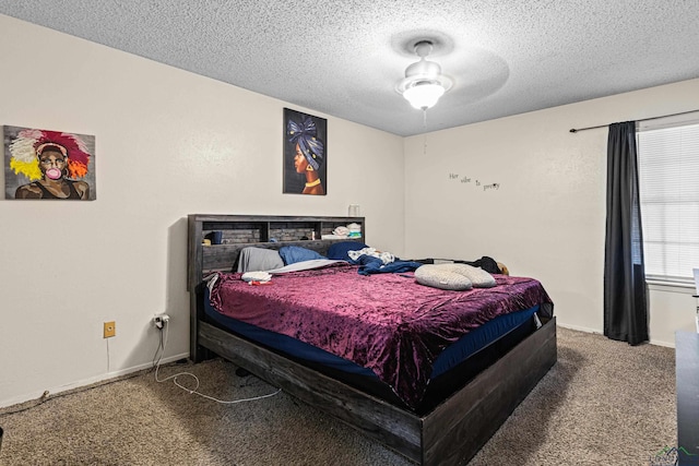 carpeted bedroom with baseboards and a textured ceiling