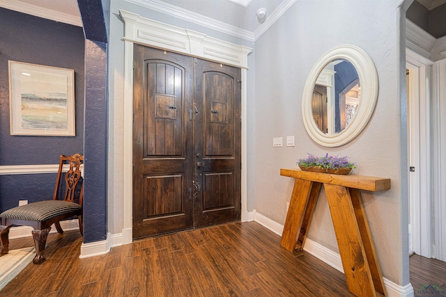 foyer entrance with dark hardwood / wood-style flooring and crown molding