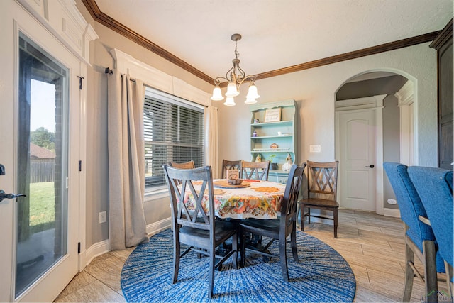 dining room featuring an inviting chandelier and ornamental molding