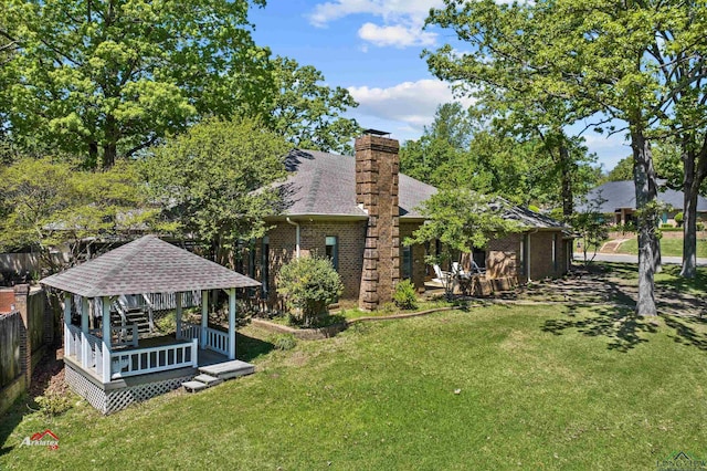 view of yard featuring a gazebo and a deck