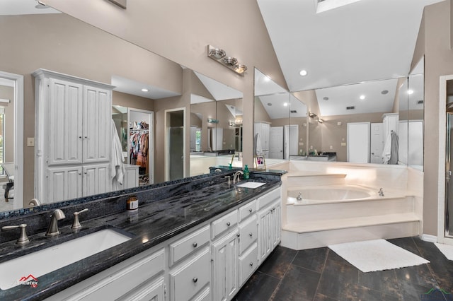 bathroom featuring plus walk in shower, vanity, and high vaulted ceiling