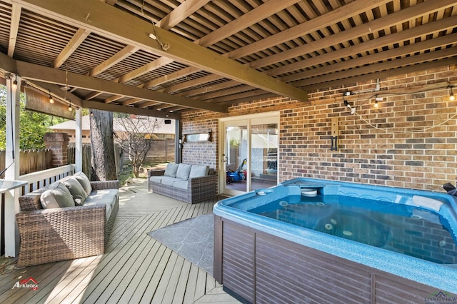 wooden terrace featuring a hot tub