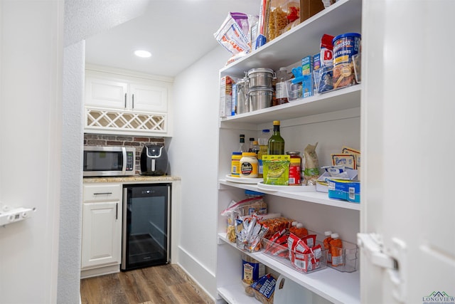 pantry featuring wine cooler