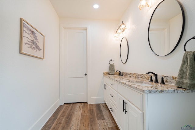 bathroom featuring vanity and wood-type flooring