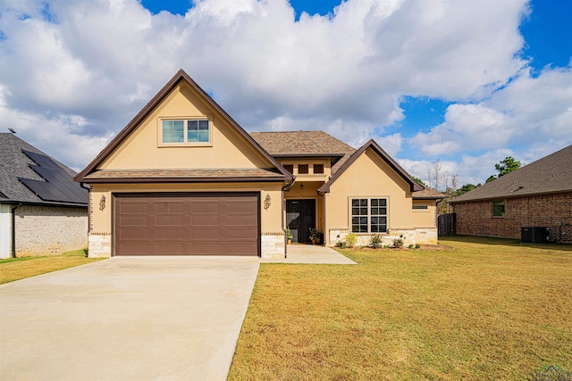 view of front of house featuring central AC unit, a front lawn, and a garage