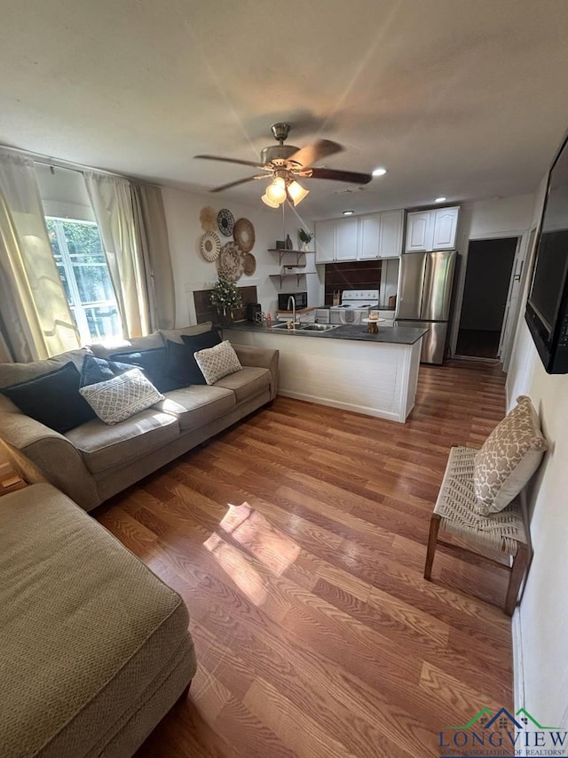 323 Gates St, Longview, TX 75601 - living room featuring a ceiling fan, wood finished floors, and recessed lighting