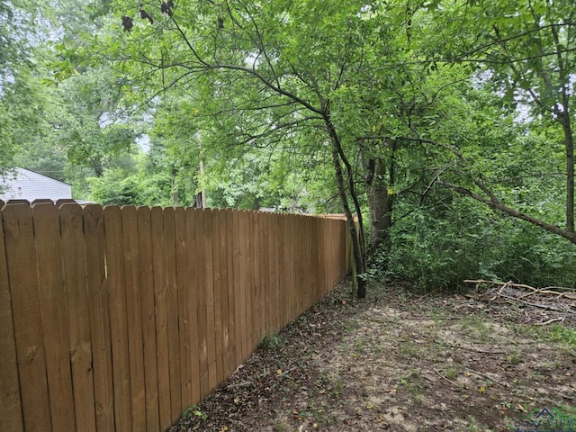 323 Gates St, Longview, TX 75601 - view of yard featuring a wooded view
