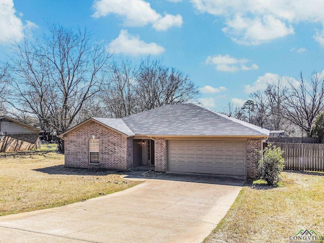 ranch-style house featuring brick siding, fence, concrete driveway, a front yard, and an attached garage