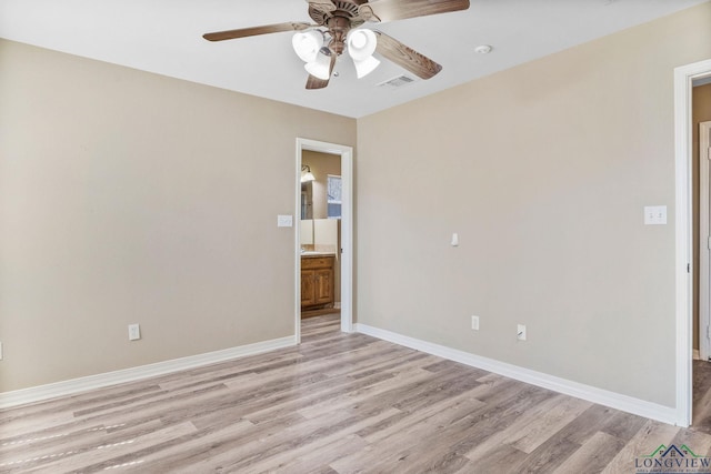 spare room with visible vents, ceiling fan, baseboards, and light wood-style floors