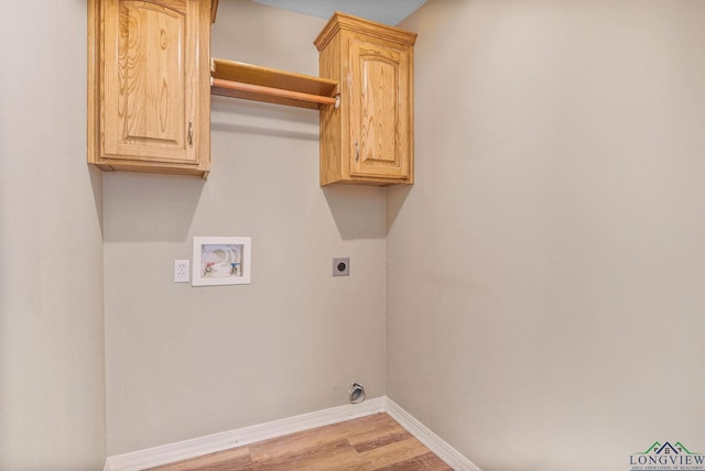 clothes washing area with hookup for a washing machine, wood finished floors, baseboards, cabinet space, and electric dryer hookup