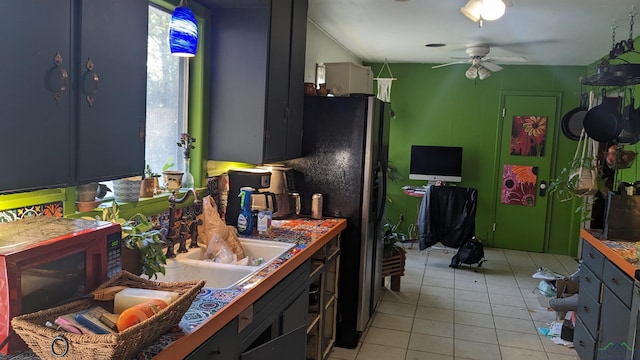 105 Bernard Blvd, Naples, TX 75568 - kitchen with a ceiling fan, light tile patterned floors, and stainless steel fridge with ice dispenser