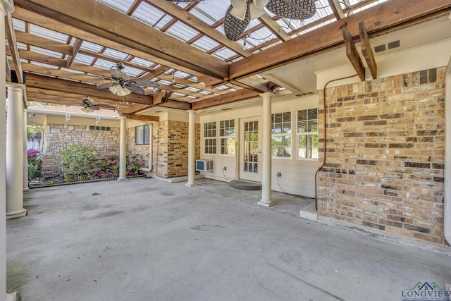 view of patio / terrace with a ceiling fan, a pergola, a wall mounted air conditioner, and water heater