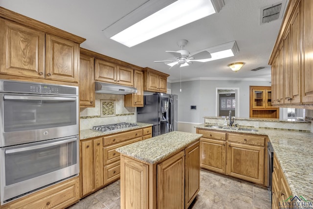 kitchen with appliances with stainless steel finishes, backsplash, a peninsula, under cabinet range hood, and crown molding