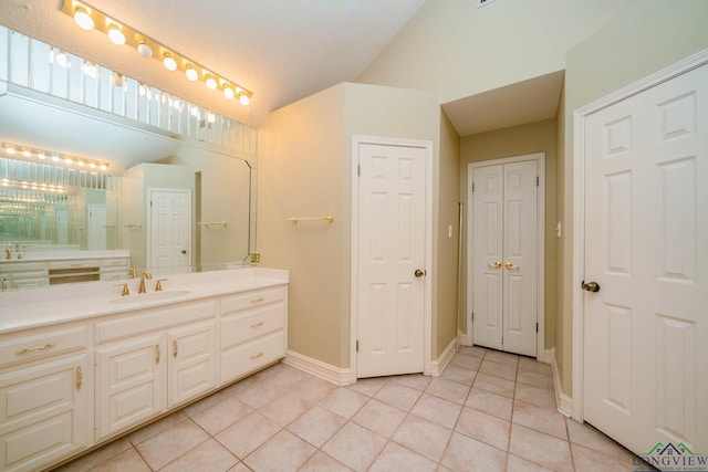 315 Tealwood Dr, Longview, TX 75605 - full bathroom featuring tile patterned floors, vanity, lofted ceiling, and a closet