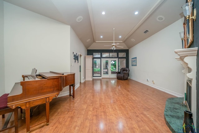315 Tealwood Dr, Longview, TX 75605 - living area with ceiling fan, vaulted ceiling, light wood-style flooring, a fireplace with raised hearth, and recessed lighting