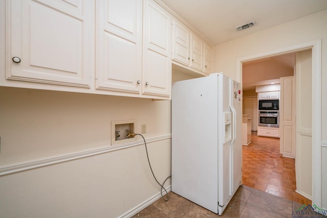 315 Tealwood Dr, Longview, TX 75605 - laundry area featuring cabinet space and hookup for a washing machine