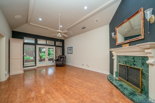 315 Tealwood Dr, Longview, TX 75605 - unfurnished living room featuring a premium fireplace, wood finished floors, lofted ceiling, ceiling fan, and french doors