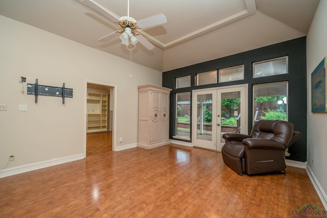 315 Tealwood Dr, Longview, TX 75605 - sitting room featuring french doors, a ceiling fan, wood finished floors, and a towering ceiling