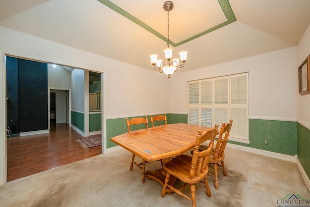 315 Tealwood Dr, Longview, TX 75605 - dining space with a chandelier, carpet, lofted ceiling, and wainscoting